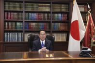 Japan’s former Foreign Minister Fumio Kishida poses for a portrait picture following his press conference at the headquarters of the Liberal Democratic Party after he was elected as party president in Tokyo Wednesday, Sept. 29, 2021. Kishida won the governing party leadership election on Wednesday and is set to become the next prime minister, facing the imminent task of addressing a pandemic-hit economy and ensuring a strong alliance with Washington to counter growing regional security risks. (Du Xiaoyi/Pool Photo via AP)