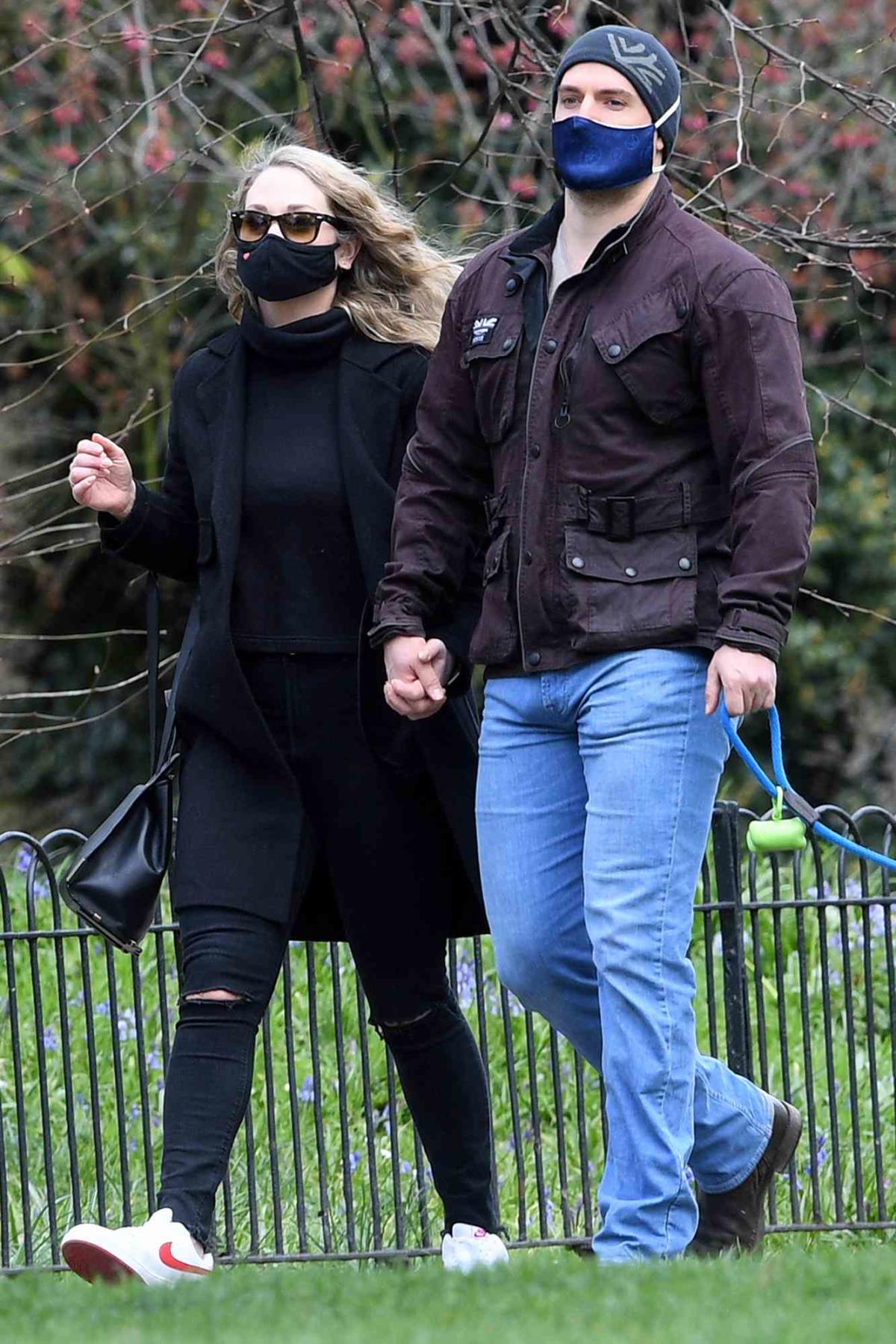 The Witcher star Henry Cavill goes public with his new girlfriend on dog  walk