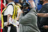 Detroit Lions head coach Matt Patricia adjusts his face mask during the second half of an NFL football game against the Houston Texans, Thursday, Nov. 26, 2020, in Detroit. (AP Photo/Paul Sancya)