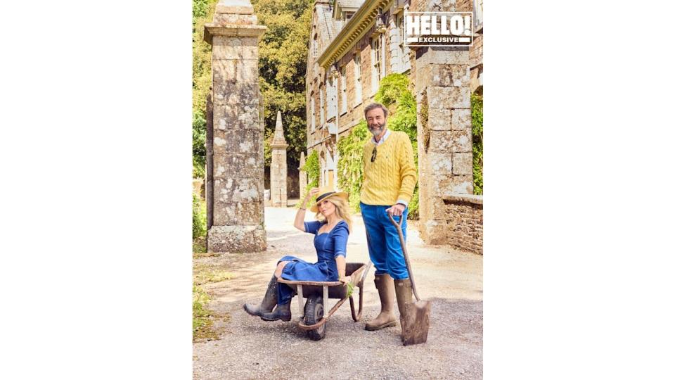 Donna Ida posing in wheelbarrow with husband Robert Walton outside Langdon Court