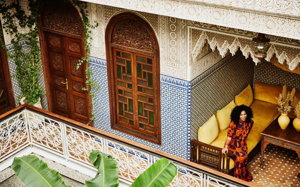 woman relaxing in riad while on vacation in Marrakech