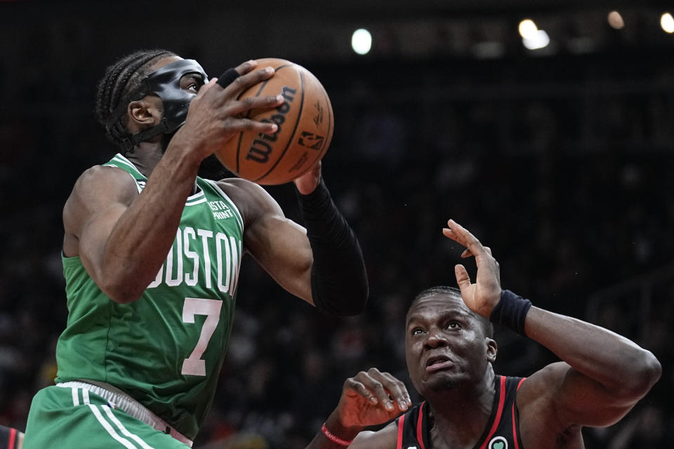 Boston Celtics guard Jaylen Brown (7) looks to score against Atlanta Hawks center Clint Capela (15) during the first half of Game 6 of a first-round NBA basketball playoff series, Thursday, April 27, 2023, in Atlanta. (AP Photo/Brynn Anderson)