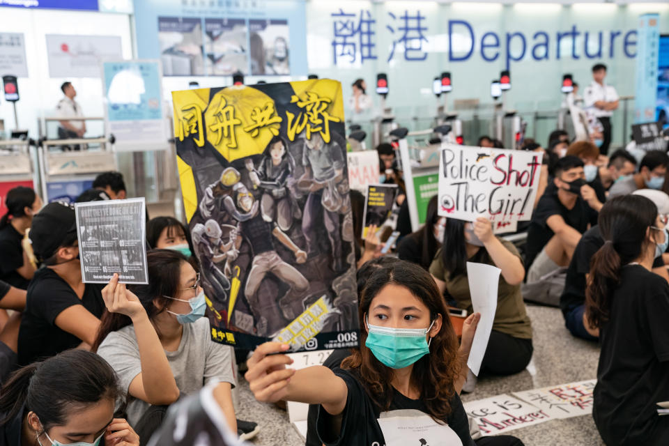 HONG KONG, CHINA - AUGUST 13: Protesters occupy the departure hall of the Hong Kong International Airport during a demonstration on August 13, 2019 in Hong Kong, China. Pro-democracy protesters have continued rallies on the streets of Hong Kong against a controversial extradition bill since 9 June as the city plunged into crisis after waves of demonstrations and several violent clashes. Hong Kong's Chief Executive Carrie Lam apologized for introducing the bill and declared it "dead", however protesters have continued to draw large crowds with demands for Lam's resignation and completely withdraw the bill. (Photo by Anthony Kwan/Getty Images)