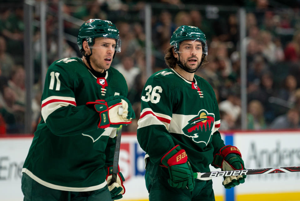 Minnesota Wild forward Mats Zuccarello (36) and forward Zach Parise (11)