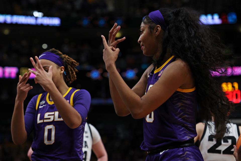 LaDazhia Williams, #0, and Angel Reese, #10, reacting after defeating the Iowa Hawkeyes 102-85 during the 2023 NCAA Women's Basketball Tournament National Championship