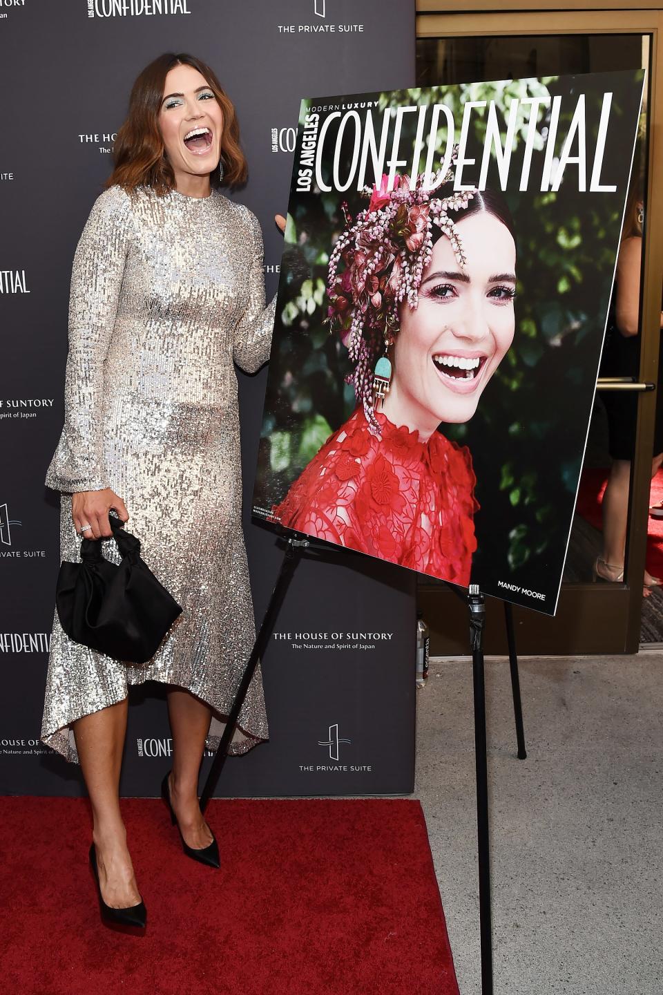 Mandy Moore proudly poses next to her cover at the <em>L.A.</em> <em>Confidential </em>Impact Awards at the Line Hotel on Sunday in L.A.