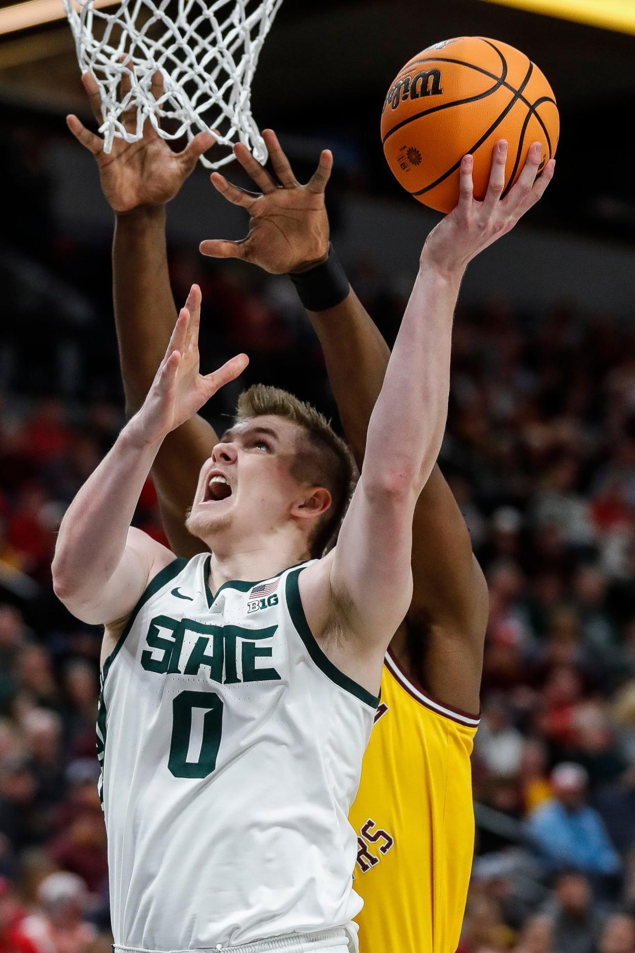 Michigan State forward Jaxon Kohler (0) goes to the basket against Minnesota forward Pharrel Payne (21) during the first half of Second Round of Big Ten tournament at Target Center in Minneapolis, Minn. on Thursday, March 14, 2024.