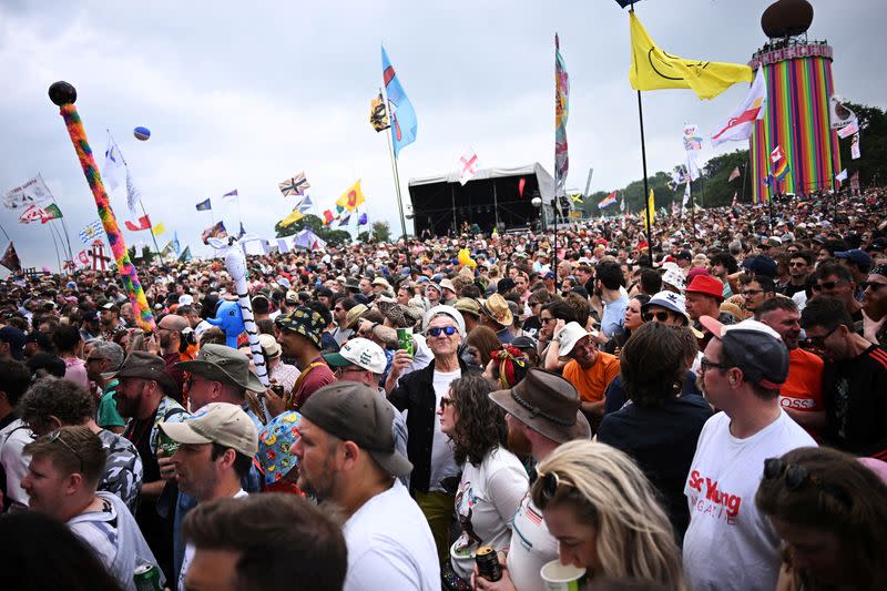 Revellers dance at The Park stage at Worthy Farm in Somerset during the Glastonbury Festival