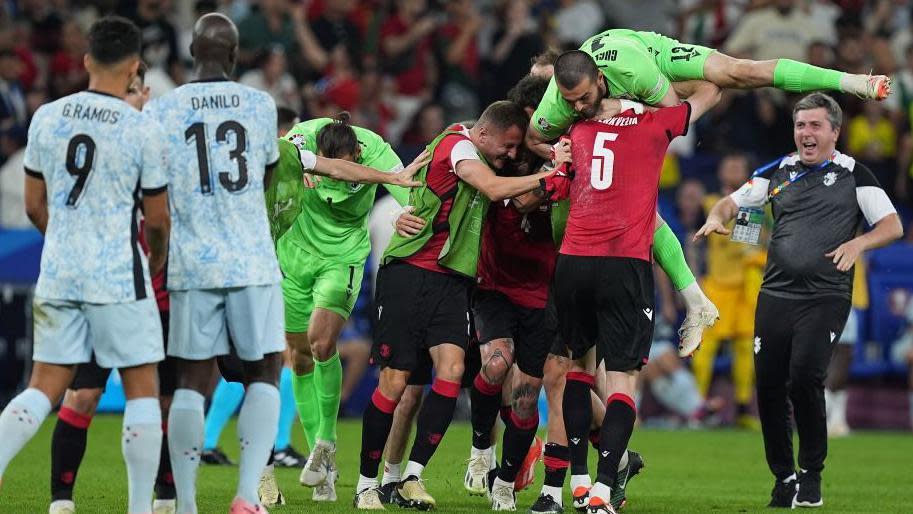 Georgia celebrate after beating Portugal