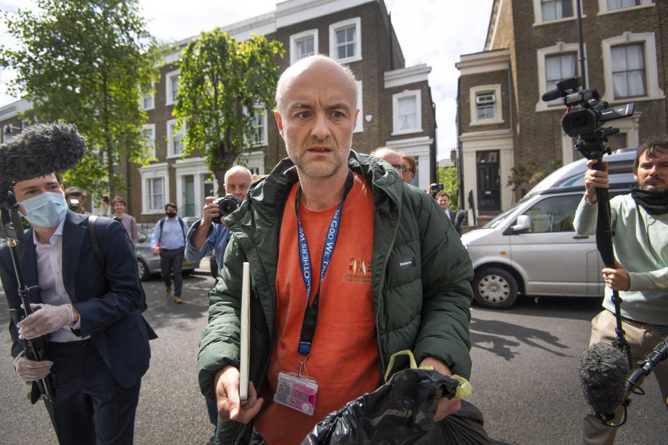 Britain's Prime Minister Boris Johnson's senior aid Dominic Cummings leaves his home, in London, Sunday, May 24, 2020. Several lawmakers from Britain’s governing Conservative Party have joined opposition calls for Johnson’s top aide to be fired for flouting lockdown rules. Dominic Cummings traveled 250 miles (400 kms) to his parents’ home with his wife and son as he was coming down with COVID-19 at the end of March. (Victoria Jones/PA via AP)