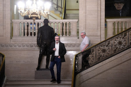 Sinn Fein's Gerry Adams and his advisor Richard McAuley leave Parliament buildings at Stormont for the last time in his role as Sinn Fein President in Belfast, Northern Ireland, February 9, 2018. REUTERS/Clodagh Kilcoyne