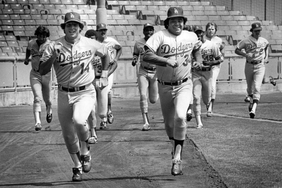 Dodgers pitcher Fernando Valenzuela races Mike Scioscia in a 1981 workout.