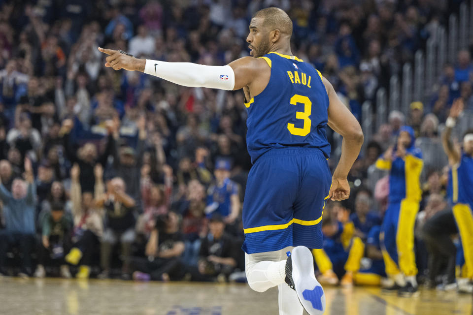 Golden State Warriors guard Chris Paul (3) gestures to a teammate during the first half of an NBA basketball game against the Utah Jazz, Sunday, April 7, 2024, in San Francisco. (AP Photo/Nic Coury)