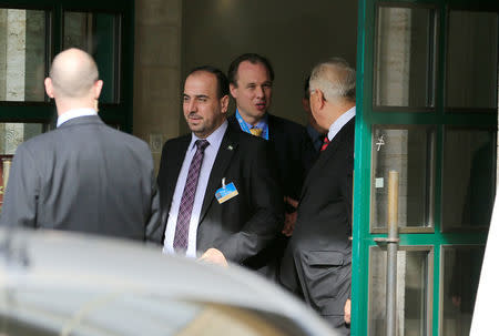 Head of opposition delegation for the Geneva IV conference on Syria Nasr al-Hariri (C) leaves the United Nations office in Geneva, Switzerland, February 23, 2017. REUTERS/Pierre Albouy