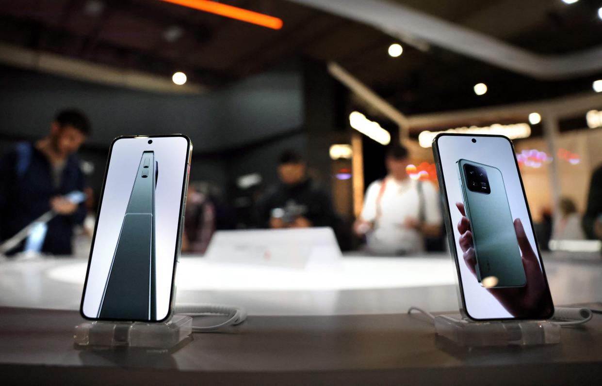 A picture taken on February 27, 2023 shows new mobile phones on Chinese company Xiaomi stand at the Mobile World Congress (MWC), the telecom industry's biggest annual gathering, in Barcelona.