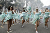 <p>Costumed revellers perform in the parade during the Notting Hill Carnival in London, Monday, Aug. 27, 2018. (Photo: Tim Ireland/AP) </p>