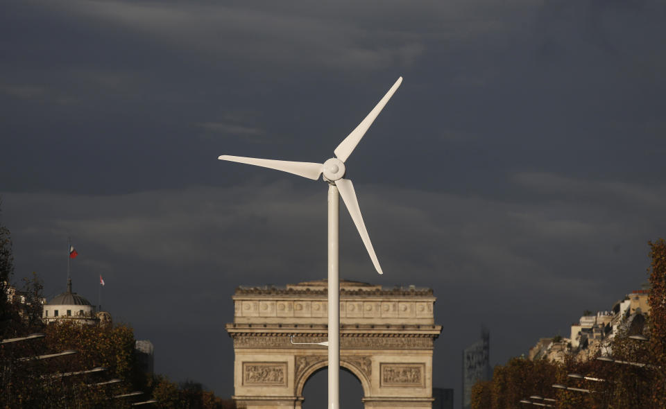 A power-generating windmill turbine is seen in front of the Arc de Triomphe on the Champs Elysees avenue in Paris ahead of the COP21 World Climate Summit, France, November 25, 2015. The upcoming conference of the 2015 United Nations Framework Convention on Climate Change (COP21) will start on November 30, 2015 at Le Bourget near the French capital.   REUTERS/Christian Hartmann  TPX IMAGES OF THE DAY