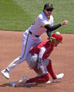 Pittsburgh Pirates second baseman Alika Williams, left, gets off the throw to first over a sliding Los Angeles Angels' Zach Neto, to complete a double play on Angels' Ehire Adrianza during the third inning of a baseball game in Pittsburgh, Wednesday, May 8, 2024. (AP Photo/Gene J. Puskar)