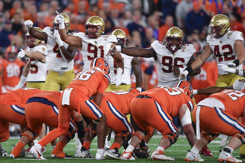 Boston College defensive end Neto Okpala, left, defensive lineman George Rooks (91), defensive tackle Cam Horsley (96) and linebacker Vinny DePalma (42) react to what they saw as an infraction committed by Syracuse during the first half of an NCAA college football game in Syracuse, N.Y., Friday, Nov. 3, 2023. (AP Photo/Adrian Kraus)