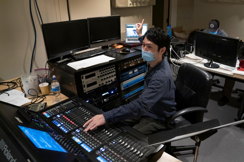 Sound engineer Akihiro Nishimura works in a recording room at the DSO as conductor Daniel Slatkin works out a score for the documentary 'Gradually, Then Suddenly: The Bankruptcy of Detroit' at the DSO in Detroit on Dec. 6, 2021.
