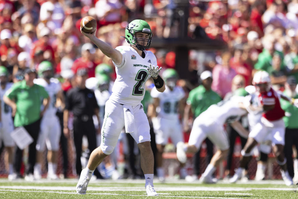 North Dakota quarterback Tommy Schuster (2) passes the ball against Nebraska during the first half of an NCAA college football game Saturday, Sept. 3, 2022, in Lincoln, Neb. (AP Photo/Rebecca S. Gratz)