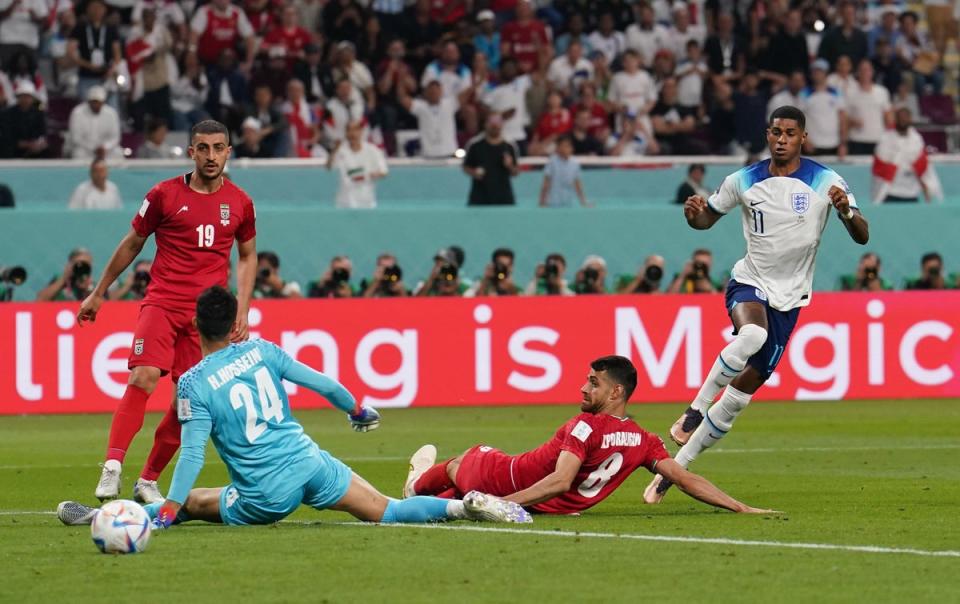 England’s Marcus Rashford scores their side’s fifth goal of the game (PA)