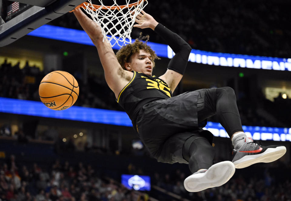 Missouri forward Noah Carter dunks during the first half of an NCAA college basketball game against Alabama in the semifinals of the Southeastern Conference Tournament, Saturday, March 11, 2023, in Nashville, Tenn. (AP Photo/John Amis)