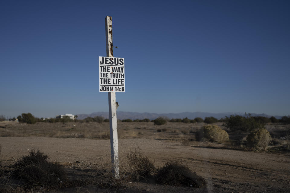 A sign with a Bible verse is seen in Hesperia, Calif., Thursday, Dec. 8, 2022. Voters in one of Southern California's largest counties have delivered a pointed if largely symbolic message about frustration in the nation's most populous state: Officials will soon begin studying whether to break free from California and form a new state. (AP Photo/Jae C. Hong)