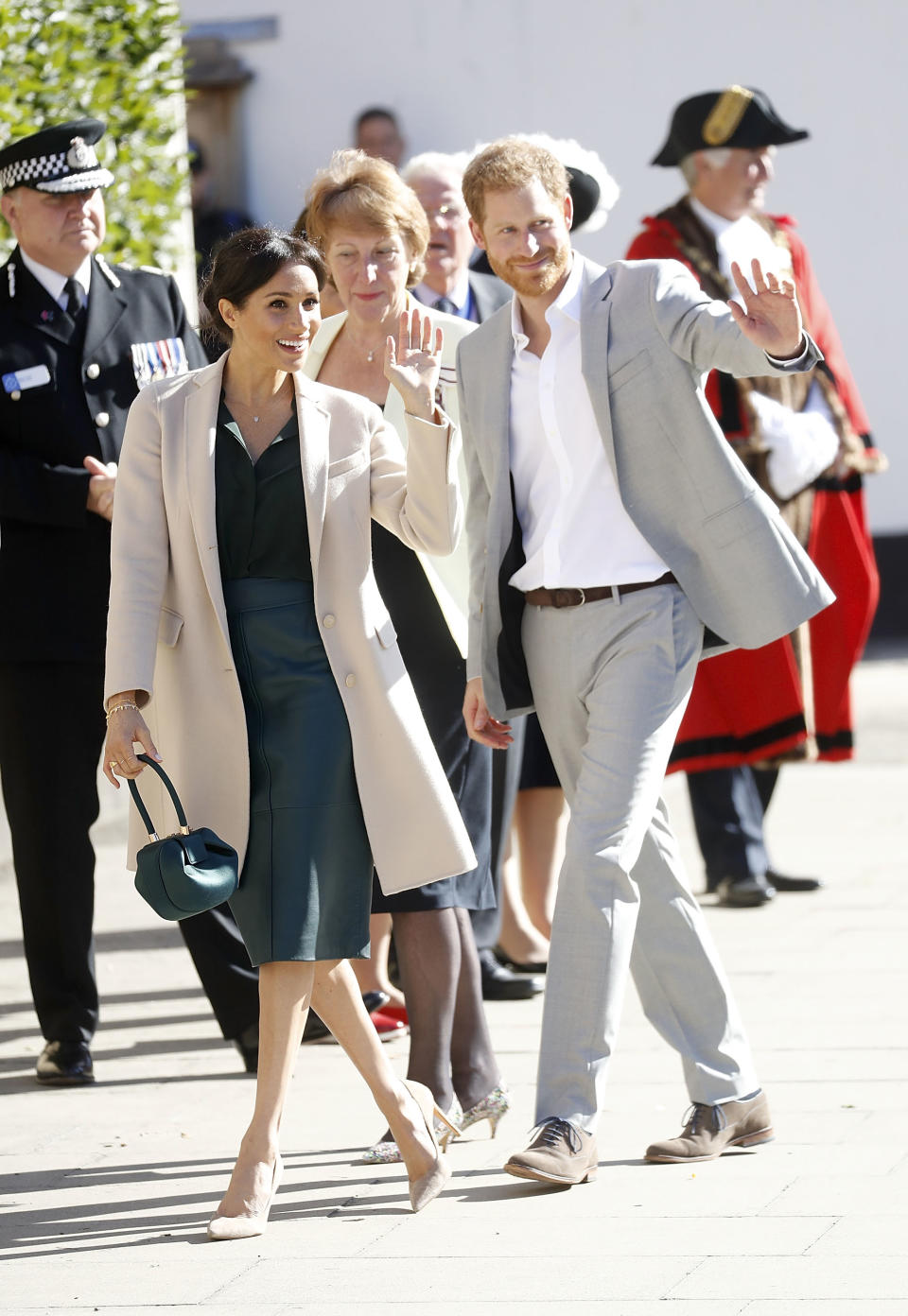 Meghan’s expensive outfit includes a coat by Armani, a BOSS skirt and a Gabriela Hearst bag [Photo: Getty]