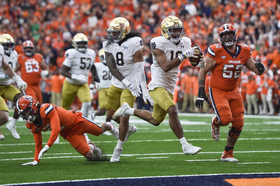 Notre Dame safety Brandon Joseph (16) returns an interception for a touchdown against Syracuse during the first half of an NCAA college football game in Syracuse, N.Y., Saturday, Oct. 29, 2022. (AP Photo/Adrian Kraus)