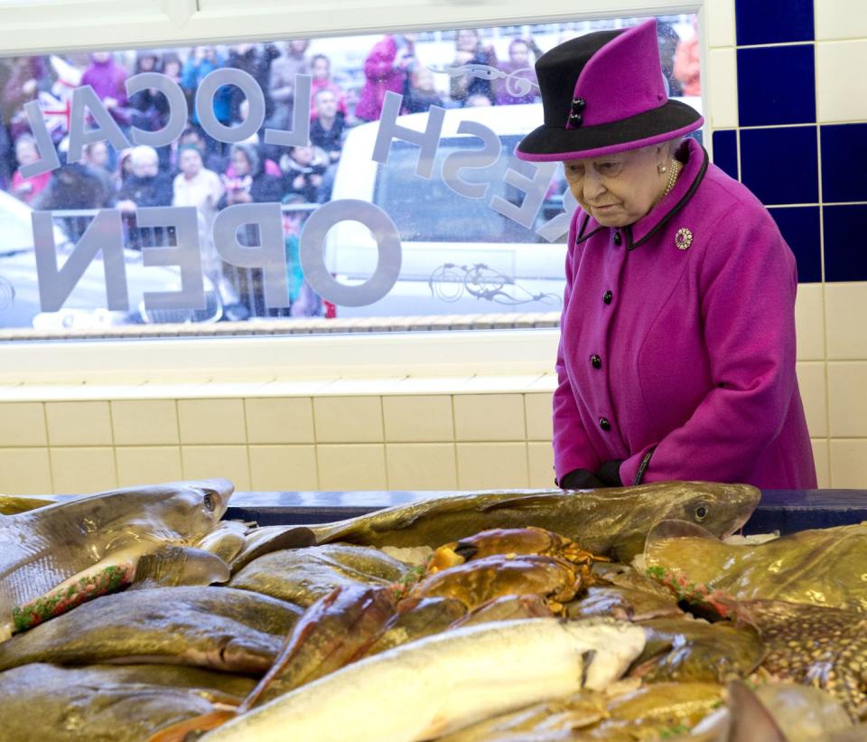 16 Photos of Queen Elizabeth, Prince Charles, and Other Royals at the Grocery Store