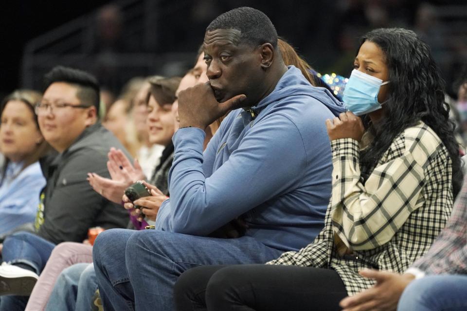 Former SuperSonics forward Shawn Kemp sits courtside at a Seattle Storm WNBA game in Seattle on May 18. (Ted S. Warren / AP file)