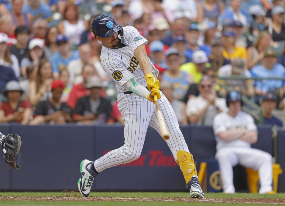 Milwaukee Brewers' Willy Adames hits a three-run home run against the Cincinnati Reds during the sixth inning of a baseball game, Sunday, June 16, 2024, in Milwaukee. (AP Photo/Jeffrey Phelps)