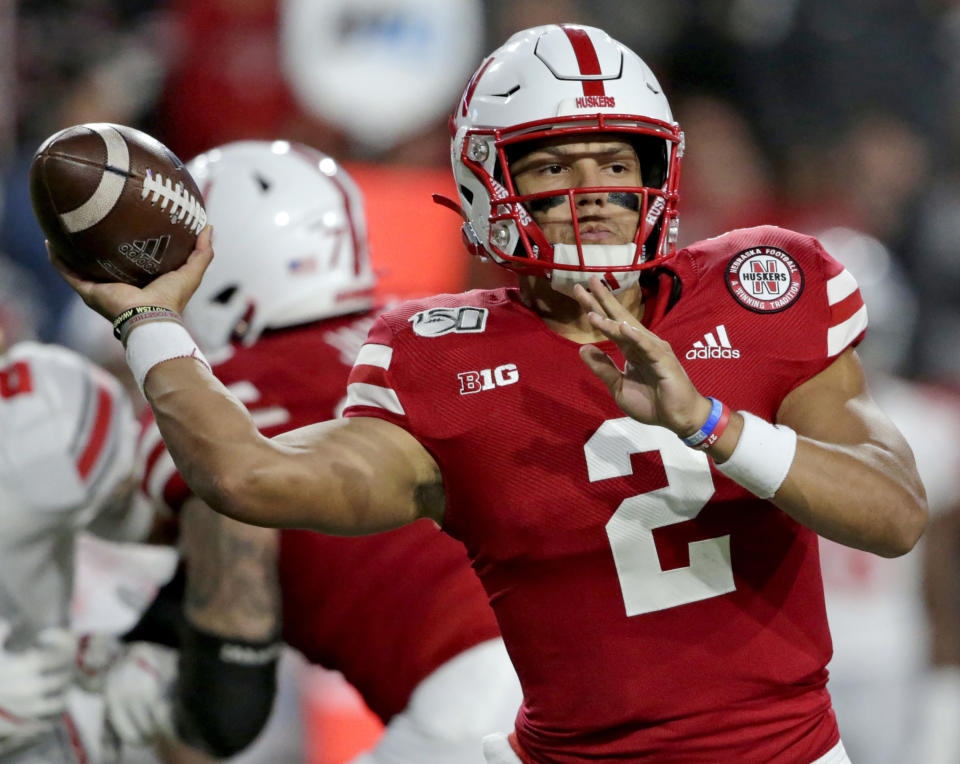 FILE - In this Sept. 28, 2019, file photo, Nebraska quarterback Adrian Martinez (2) throws a pass during the first half of an NCAA college football game against Ohio State in Lincoln, Neb. Third-year starting quarterback Martinez will be looking to bounce back after an injury-plagued season. (AP Photo/Nati Harnik, File)