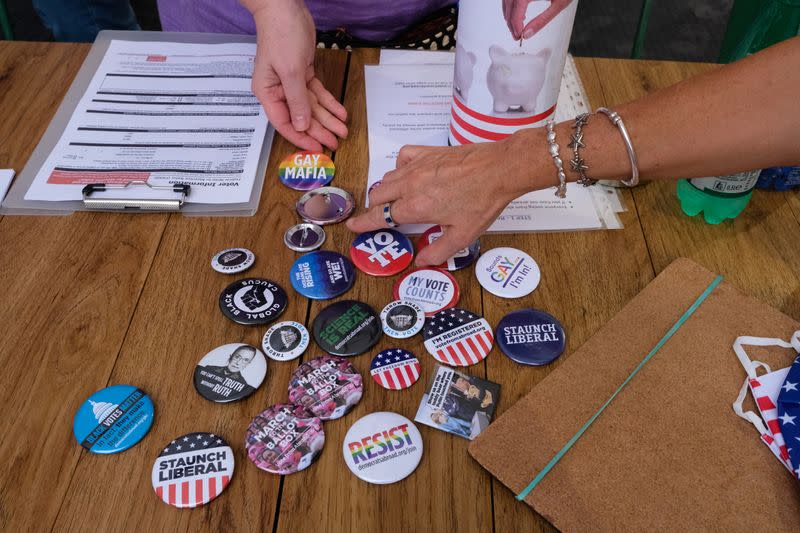 FILE PHOTO: Democratic party volunteers lay out badges at Rome voter event