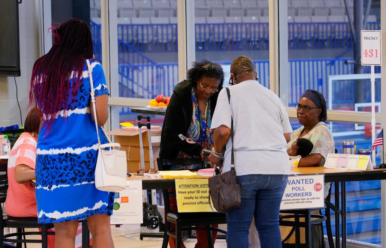 People vote Tuesday at Millwood Field House in the primary elections. Voters headed to the polls to select candidates for the statehouse, Congress and Oklahoma Corporation Commission. For election updates and results, go to oklahoman.com.