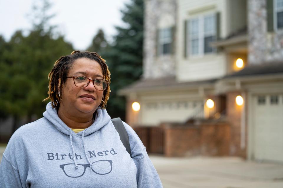 Doula Erika Millender stands outside of a home following a post-natal visit in Dearborn on January 12, 2023.
Doulas serve birthing people prenatally, during labor and delivery and after a baby is born. Clients typically pay out of pocket for doula services, which have been proven to improve maternal and infant health outcomes.
Effective Jan. 1, Michigan Medicaid will reimburse doulas for their services. The state says it's in part an effort to increase equity and address racial disparities. Doulas see the policy as a positive validation of their work but are disappointed by the relatively low rate at which Medicaid will reimburse.