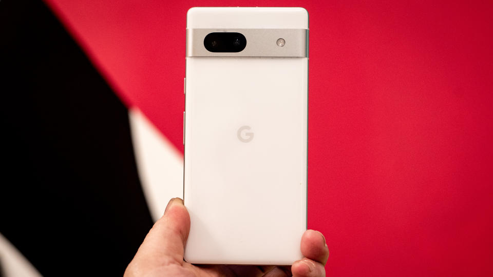 Google Pixel 7a phone showing screens camera and Android 13