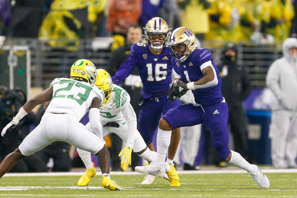 Nov 6, 2021; Seattle, Washington, USA; Washington Huskies wide receiver Terrell Bynum (1) runs for yards after the catch against the Oregon Ducks during the second quarter at Alaska Airlines Field at Husky Stadium. Mandatory Credit: Joe Nicholson-USA TODAY Sports