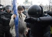 Riot police detain pregnant Nadezhda Tolokonnikova (C) during a dissenters march in Moscow March 3, 2008. Tolokonnikova later became a member of Pussy Riot.
