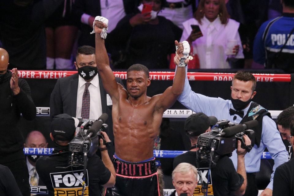 Errol Spence Jr. celebrates after defeating Danny Garcia by unanimous decision in the WBC-IBF welterweight boxing bout in Arlington, Texas, Saturday, Dec. 5, 2020. (AP Photo/Brandon Wade)