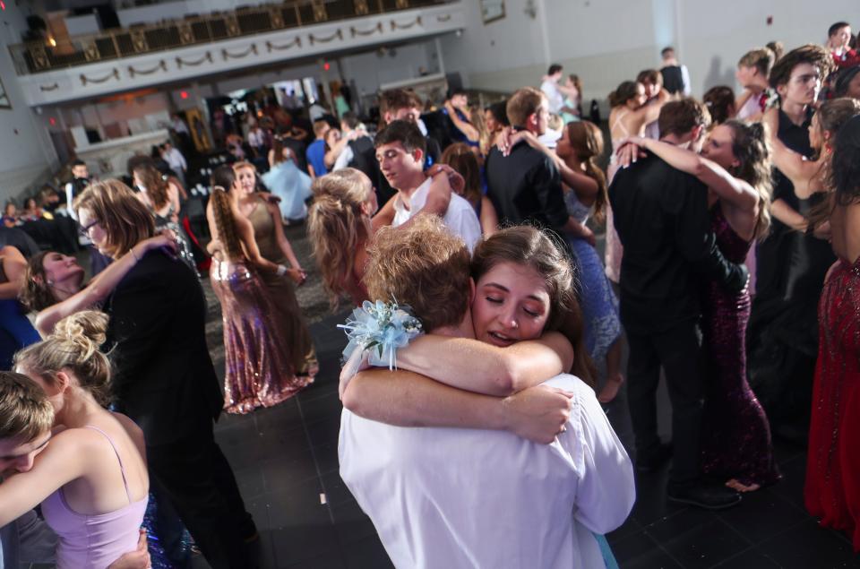 Teens danced arm-in-arm in one of the few slow songs during the 2020 'Starry Nights' prom for New Albany junior and seniors.