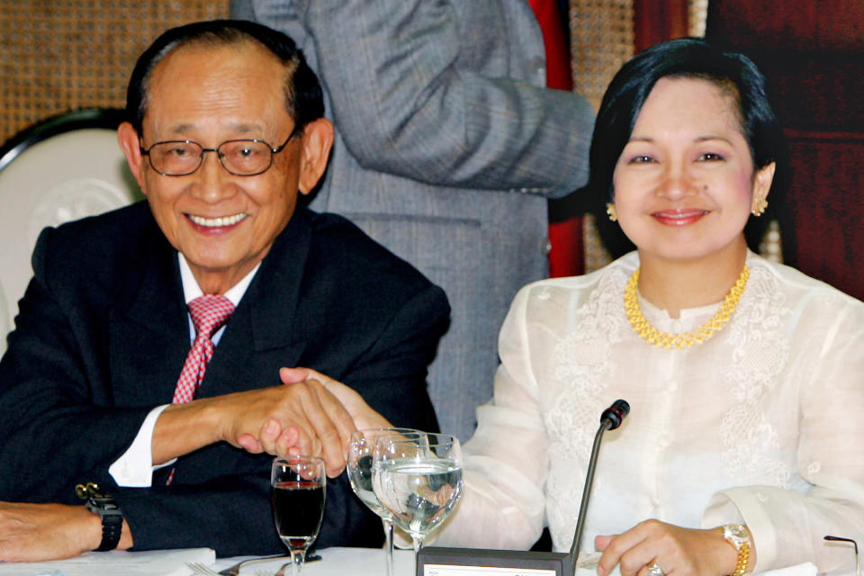 FILE - President Gloria Macapagal Arroyo, right, shakes hands with former President Fidel Ramos during the ruling party LAKAS-CMD (Christian Muslim Democrats) meeting on Jan. 14, 2006, at the Malacanang palace in Manila. Ramos, a U.S.-trained ex-general who saw action in the Korean and Vietnam wars and played a key role in a 1986 pro-democracy uprising that ousted a dictator, has died. He was 94. Some of Ramos's relatives were with him when he died on Sunday, July 31, 2022, said his longtime aide Norman Legaspi. (AP Photo/Pat Roque, File)