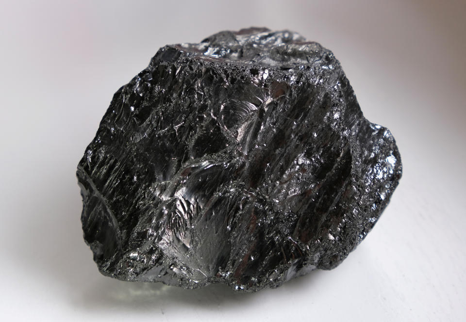 FILE PHOTO: A piece of anthracite stone coal the size of a tennis ball, extracted from Germany's second last coal mine "Von Oeynhausen" in Ibbenbueren of the RAG foundation