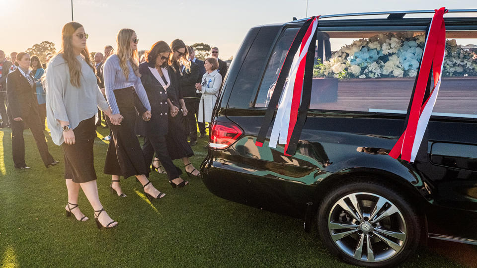 Danny Frawley's wife and daughters, pictured here during a lap of honour at his memorial service.