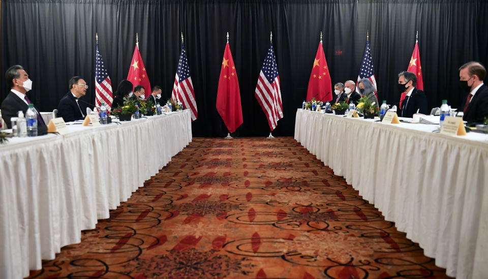 FILE - In this March 18, 2021, file photo Secretary of State Antony Blinken, second from right, joined by national security adviser Jake Sullivan, right, speaks while facing Chinese Communist Party foreign affairs chief Yang Jiechi, second from left, and China's State Councilor Wang Yi, left, at the opening session of US-China talks at the Captain Cook Hotel in Anchorage, Alaska. U.S. relations with its two biggest geo-political rivals are facing severe tests as President Joe Biden tries to assert himself as the world's foremost anti-authoritarian leader and distinguish himself from his predecessor. (Frederic J. Brown/Pool via AP, File)