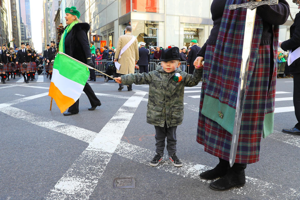 A youngster waves a flag while marching in the St. Patrick's Day Parade, March 16, 2019 in New York. (Photo: Gordon Donovan/Yahoo News)