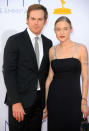 “Dexter” actor Michael C. Hall, 41, seems to be moving on after his divorce last year. On the Emmys red carpet he introduced his new girlfriend, Morgan Macgregor. Macgregor, 23, is a blond with Angelina Jolie-esque tattoos on her arms, wrists and shoulders. She made a dramatic entrance in a long black gown with straps that looked to be barbed-wire inspired. Macgregor, a book critic, <a href="http://bookriot.com/staff-contributors/morgan-macgregor/" rel="nofollow noopener" target="_blank" data-ylk="slk:is a fan;elm:context_link;itc:0;sec:content-canvas" class="link ">is a fan</a> of “public radio, lattes, and doing her makeup in public,” and is working on a novel. The couple held hands down the carpet and <a href="http://www.usmagazine.com/celebrity-news/news/michael-c-hall-packs-on-pda-with-new-girlfriend-morgan-macgregor-at-2012-emmy-awards-2012249" rel="nofollow noopener" target="_blank" data-ylk="slk:they were;elm:context_link;itc:0;sec:content-canvas" class="link ">they were</a> “totally together and cute” at the event. Hall split with his co-star, Jennifer Carpenter, after three years of marriage. In 2010, he underwent treatment for Hodgkin's lymphoma, which is now in remission.