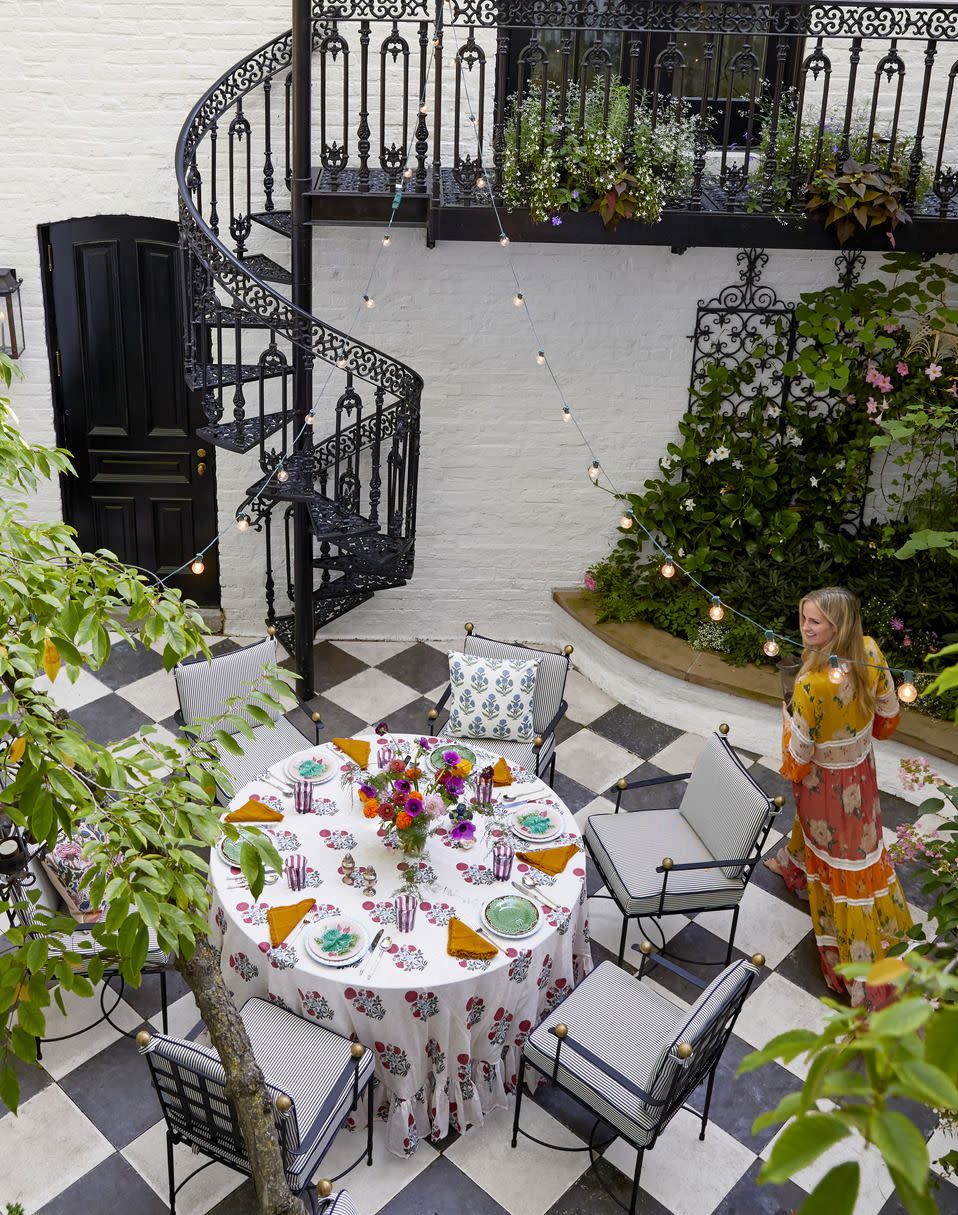 in the courtyard, classic stripes cloak steel dining chairs