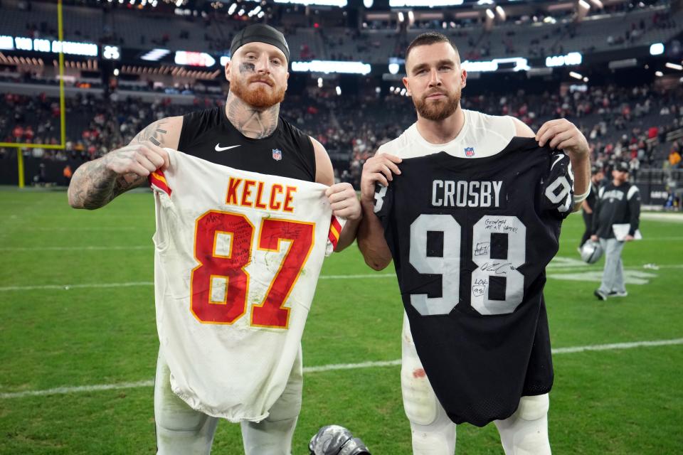 Jan 7, 2023; Paradise, Nevada, USA; Las Vegas Raiders defensive end Maxx Crosby (left) and Kansas City Chiefs tight end Travis Kelce pose after exchanging jerseys after the game at Allegiant Stadium. Mandatory Credit: Kirby Lee-USA TODAY Sports